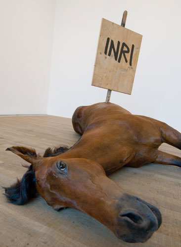 Maurizio Cattelan's Untitled dead horse with a stick in it